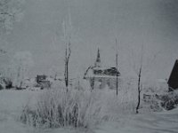 Zicht op Grote Kerk in de sneeuw